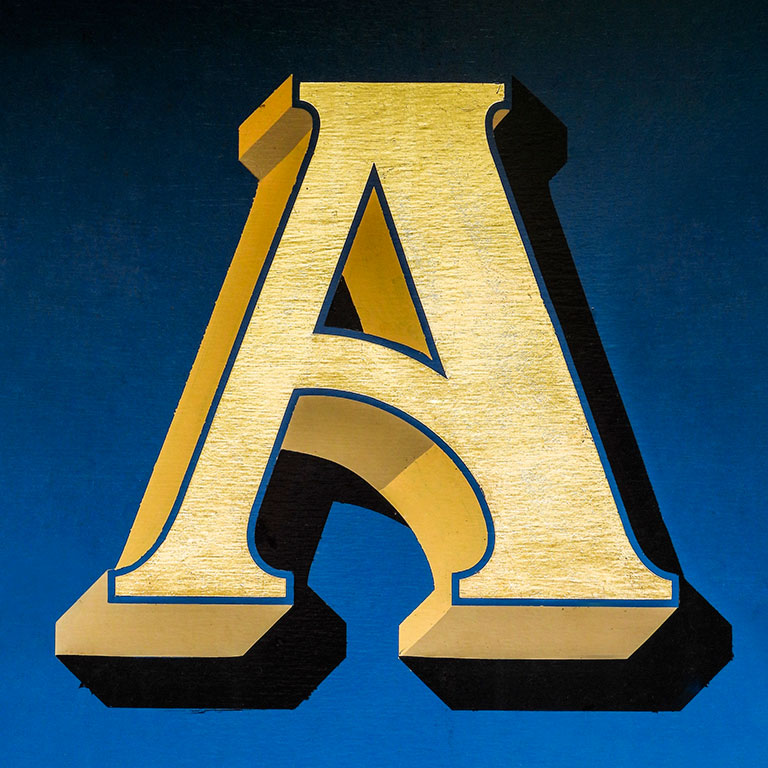 Presentation Alphabets: Black & Gold Varsity Letter A